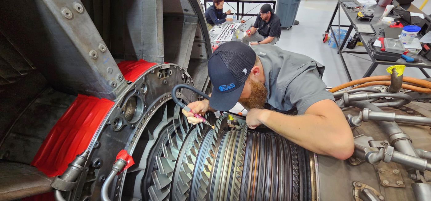 SAS technician inspecting turbine parts