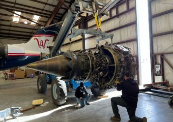 Technicians inspect airplane cockpit