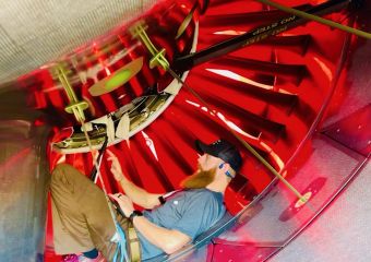 Technicians inspect airplane cockpit